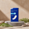 LumySmile teeth whitening strips box on a natural stone pedestal with fern