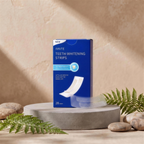 LumySmile whitening strips box with a strip on a stone pedestal